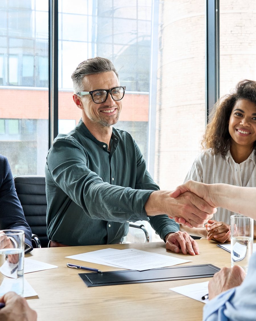 Cloud Bridge consultants and a client team shaking hands after a Business Central and analytics planning session