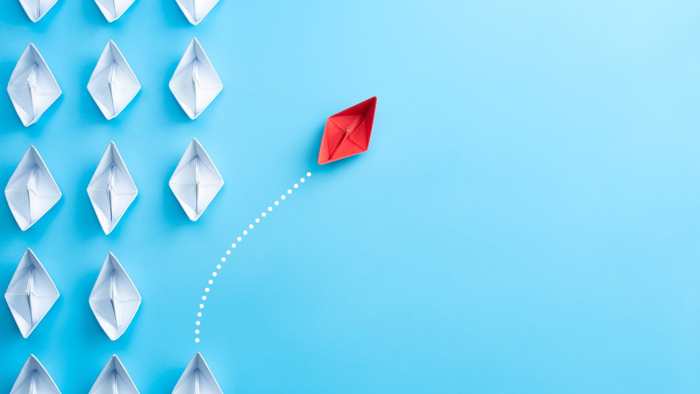 A single red vessel leading a fleet, representing a differentiated approach